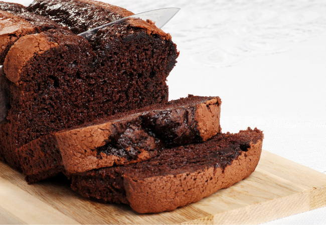 Slices of moist chocolate zucchini on a board