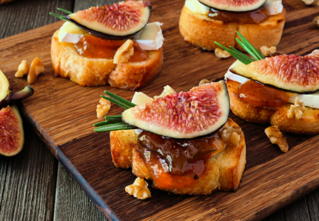 Fig balsamic jam on top of crostini with cheese