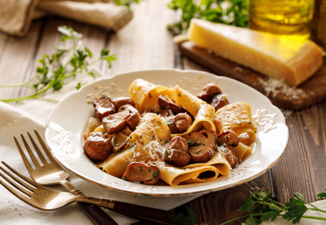 Bowl of pappardelle pasta with caramelized wild mushrooms